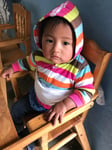 Shopper Approved Guatemala Volunteer work - toddler on jacket in chair